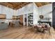 Dining room with hardwood floors, decorative hanging lights, and kitchen area view at 8307 E Gary Rd, Scottsdale, AZ 85260
