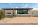 Modern home exterior showcasing contemporary design and desert landscaping at 8307 E Gary Rd, Scottsdale, AZ 85260