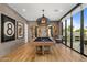 Game room features a billiard table and a seating area with access to a patio at 8307 E Gary Rd, Scottsdale, AZ 85260