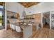 Gourmet kitchen featuring a large island, stone accents, and modern appliances at 8307 E Gary Rd, Scottsdale, AZ 85260