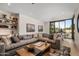 Spacious living room with comfortable seating, large windows, and access to an outdoor area at 8307 E Gary Rd, Scottsdale, AZ 85260