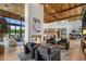 Open concept living area with fireplace, hardwood floors, high ceilings and many windows at 8307 E Gary Rd, Scottsdale, AZ 85260