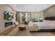 Spacious main bedroom suite featuring a fireplace, seating area and TV at 8307 E Gary Rd, Scottsdale, AZ 85260