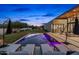 Serene pool area with lounge chairs, lush landscaping, and a modern home exterior under a twilight sky at 8307 E Gary Rd, Scottsdale, AZ 85260