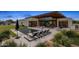 Inviting pool area with modern lounge chairs and a glimpse of the contemporary home's architectural design at 8307 E Gary Rd, Scottsdale, AZ 85260