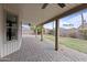 Covered back patio features brick flooring and ceiling fans at 843 W Nido Ave, Mesa, AZ 85210