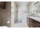 Modern bathroom with granite countertop vanity and glass-enclosed shower at 843 W Nido Ave, Mesa, AZ 85210