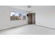 Bright bedroom featuring a large window offering outdoor views and a closet at 843 W Nido Ave, Mesa, AZ 85210