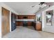Updated kitchen with stainless steel appliances, and ample cabinet space at 843 W Nido Ave, Mesa, AZ 85210