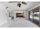 Open-concept living room and kitchen with lots of natural light through sliding glass doors at 843 W Nido Ave, Mesa, AZ 85210