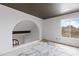 Light-filled living room with an archway and a large window overlooking the neighborhood at 843 W Nido Ave, Mesa, AZ 85210