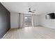 Bright living room with new floors, balcony access, and accent wall at 843 W Nido Ave, Mesa, AZ 85210