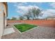 Well-kept backyard with minimal landscaping, gravel, and block wall fencing at 859 S Bristol --, Mesa, AZ 85208