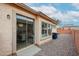 View of the backyard featuring gravel landscaping and a sliding glass door into the home at 859 S Bristol --, Mesa, AZ 85208