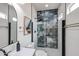 A sleek bathroom with stylish black fixtures, a tiled shower, and a decorative mirror at 859 S Bristol --, Mesa, AZ 85208