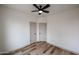 The bedroom features a ceiling fan, two closets, and wood-look luxury vinyl plank flooring at 859 S Bristol --, Mesa, AZ 85208