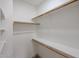 A bright, walk-in closet with built-in shelving and wooden rods offer ample storage space at 859 S Bristol --, Mesa, AZ 85208