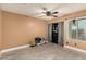 Bedroom with ceiling fan, light colored walls, and a closet with mirrored sliding doors at 923 E Aire Libre Ave, Phoenix, AZ 85022