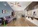 Bright and airy living room features vaulted ceilings, modern furniture, and sliding glass doors to the backyard at 923 E Aire Libre Ave, Phoenix, AZ 85022
