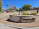 Stone sign near sidewalk marking the entrance to Greentrails Park on a sunny day at 923 E Aire Libre Ave, Phoenix, AZ 85022