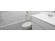 Clean bathroom with a shower-tub combination and vanity with white countertops at 9823 W Agora Ln, Tolleson, AZ 85353