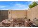 Enclosed backyard features a brick-paved patio, custom planter, and mature landscaping at 1010 E Redfield Rd, Tempe, AZ 85283