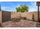 Backyard oasis features brick flooring, gated wall, and mature landscaping at 1010 E Redfield Rd, Tempe, AZ 85283