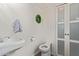 Powder room featuring a sleek pedestal sink and modern fixtures at 1010 E Redfield Rd, Tempe, AZ 85283