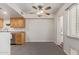 Eat-in kitchen area features grey tile flooring, ceiling fan, and natural light at 1010 E Redfield Rd, Tempe, AZ 85283