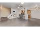 Bright living room features tile flooring, a staircase, and a breakfast bar with seating at 1010 E Redfield Rd, Tempe, AZ 85283