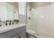 Modern bathroom featuring a glass enclosed shower, neutral tones and modern vanity at 10717 E Tarragon Ave, Mesa, AZ 85212