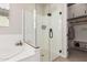 Sleek bathroom featuring a glass shower, walk-in closet, and contemporary finishes at 10717 E Tarragon Ave, Mesa, AZ 85212