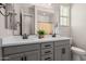 Bathroom featuring a double sink vanity, quartz countertops, and modern fixtures at 10717 E Tarragon Ave, Mesa, AZ 85212