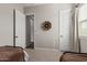 Neutral bedroom featuring twin beds, carpeted floors, and white doors at 10717 E Tarragon Ave, Mesa, AZ 85212