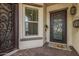 Welcoming front entrance features a wrought iron door and sidelight at 10717 E Tarragon Ave, Mesa, AZ 85212