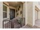 Inviting front porch features decorative sconces and an ornate security gate at 10717 E Tarragon Ave, Mesa, AZ 85212