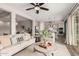 Open-concept living room shows the dining area and kitchen featuring decor and neutral colors at 10717 E Tarragon Ave, Mesa, AZ 85212