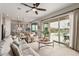 Spacious living room with sliding glass doors leading to the backyard, pool, and kitchen at 10717 E Tarragon Ave, Mesa, AZ 85212