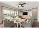 Bright living room features a ceiling fan and direct access to the outdoor patio and pool at 10717 E Tarragon Ave, Mesa, AZ 85212