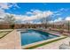 Backyard pool with blue tile and inviting outdoor seating at 10717 E Tarragon Ave, Mesa, AZ 85212