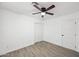 Bright bedroom featuring a ceiling fan and a closet with sliding doors at 10947 W Mohave St, Avondale, AZ 85323