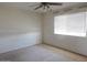 Bedroom with a ceiling fan and a window at 11410 N 105Th Ave, Sun City, AZ 85351