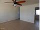 Bright living room with tile flooring and a ceiling fan at 11410 N 105Th Ave, Sun City, AZ 85351