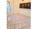 Bright dining room with tile flooring, a large window, and upper cabinets at 12046 S 44Th St, Phoenix, AZ 85044