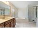 Spacious bathroom with soaking tub, walk-in shower, and ample counter space at 1213 W Esplanade St, Mesa, AZ 85201