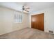 Bedroom with carpet, shutters and a closet with wood door at 1213 W Esplanade St, Mesa, AZ 85201