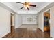 Cozy dining room with hardwood floors, ceiling fan, and access to the kitchen at 1213 W Esplanade St, Mesa, AZ 85201