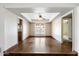 Dining room with hardwood floors and French doors leading to the outdoor pool area at 1213 W Esplanade St, Mesa, AZ 85201