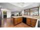 Modern kitchen with wooden cabinets, an island, and stainless steel appliances at 1213 W Esplanade St, Mesa, AZ 85201