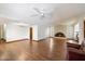 Spacious living room featuring wood floors, a fireplace, and a ceiling fan at 1213 W Esplanade St, Mesa, AZ 85201